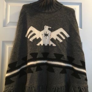 Cozy fringe poncho sweater